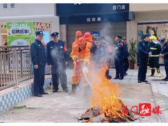 石门县住建局：以练筑防 开展物业消防实战演练