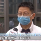 武汉大学人民医院东院区腾空11个病区:医疗队员交接 患者不舍落泪