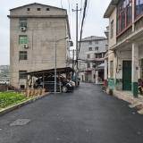 铺好最后一百米！龙泉小学入校道路完工通车