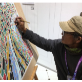 在进博会上推广传统艺术的农民画家