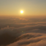 视频丨日落云冰山 余晖洒云海 