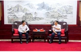 许忠建会见田卫国一行