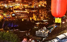 People Enjoy Night Tours in Furong Ancient Town