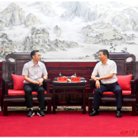 许忠建会见程伟一行