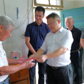 李铁雄赴桑梓镇走访慰问困难党员和困难残疾人